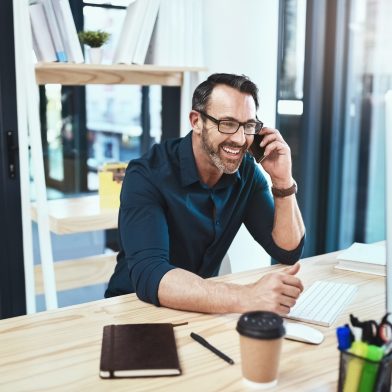 It’s always good doing business with you Shot of a mature businessman talking on his phone while sitting at his desk